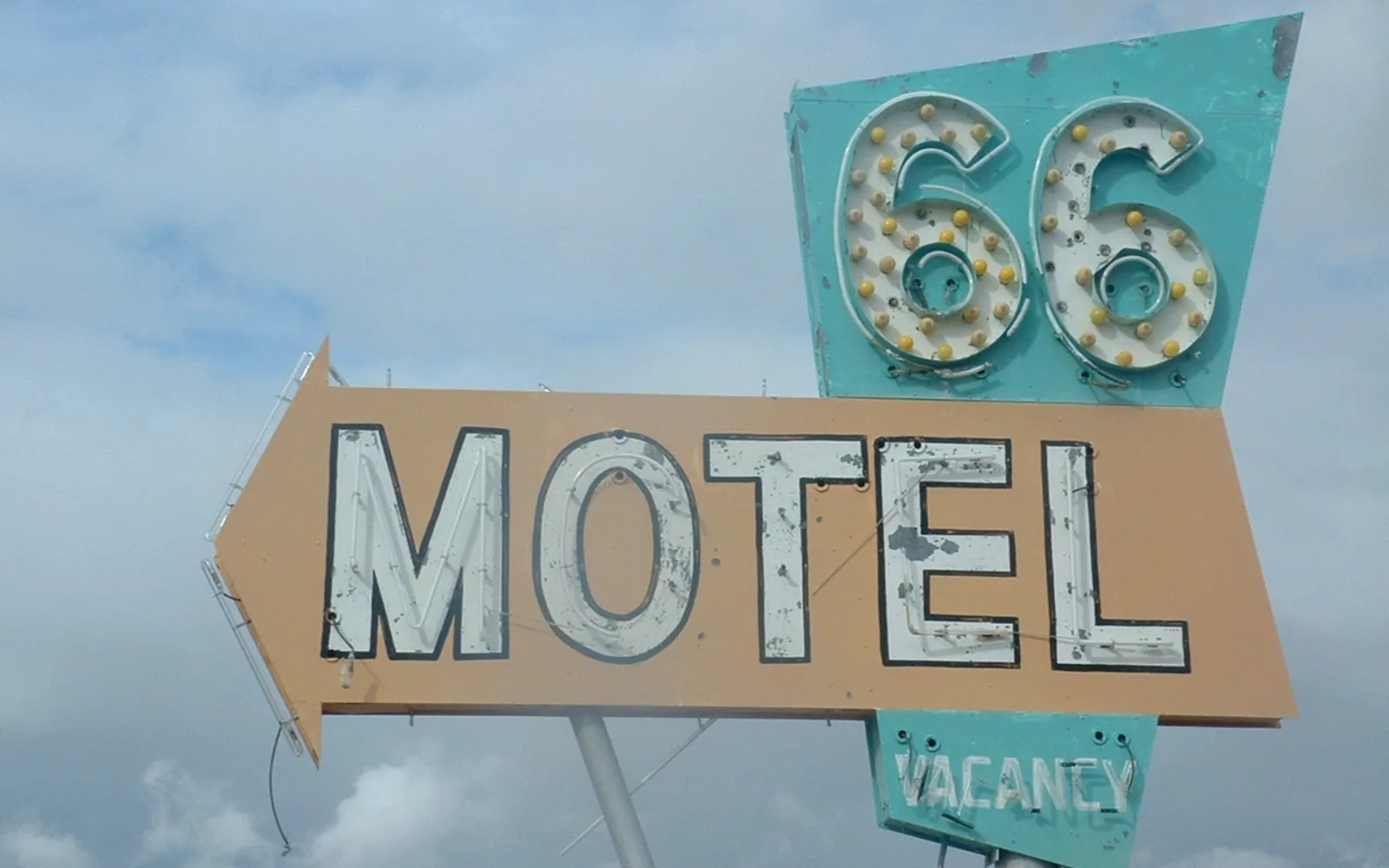 Iconic Route 66 motel sign from Needles, California, representing the historic highway's presence in Southern California